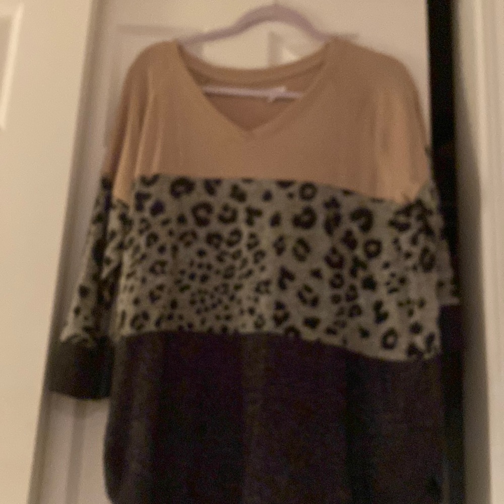 I am selling a V-neck Sweater that is leopard print from Maurice’s.